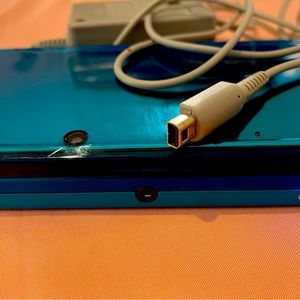 Nintendo 3DS, handheld aqua blue Body gaming console used